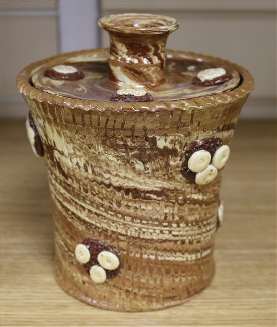 An early 19th century solid agate ware vase, the lid with a candle sconce, all over applied with raspberry prunts, height 18cm, diam.15